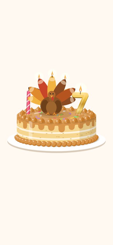 A Thanksgiving cake just blown out, the turkey candle smoking